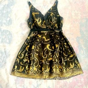 Black and gold cocktail dress, v neckline worn once. Bought from Nordstrom